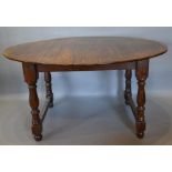 An 18th Century and Later Oval Dining Table, the oval plank top above baluster turned legs with