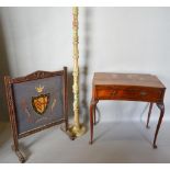 A Carved Oak Fire Screen with Embroidery 'Clare College Cambridge' together with an onyx lamp