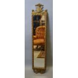 A 19th Century Gilded Dressing Mirror with pierced shaped surmount, 115 x 23 cms