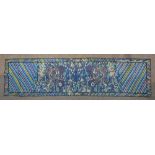 An Early Chinese Embroidered Panel with serpents amongst foliage and waves and coloured stripes,