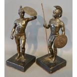 A Pair of Patinated Bronze Figures in the form of Roman Centurions with Shield and Spear, upon