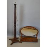 A Victorian Mahogany Oval Toilet Mirror, the oval mirror with shaped supports above a three drawer