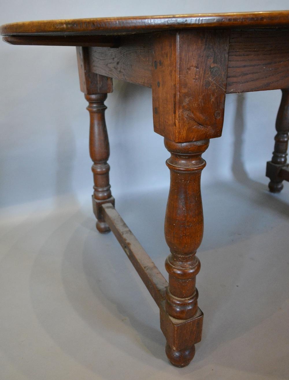 An 18th Century and Later Oval Dining Table, the oval plank top above baluster turned legs with - Image 2 of 2