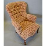 A Low Seat Drawing Room Armchair with a button upholstered back above a stuff over seat, raised upon