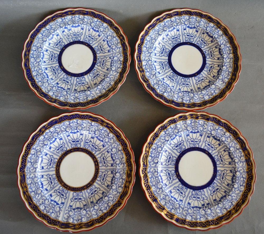 A Set of Four 19th Century Worcester Porcelain Plates decorated in underglaze blue, highlighted with