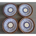 A Set of Four 19th Century Worcester Porcelain Plates decorated in underglaze blue, highlighted with