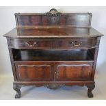 A Good Quality Early 20th Century Mahogany Serving Cabinet by Waring & Gillow, Paris, the low carved