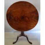 A George III Mahogany Pedestal Table, the circular top above a wrythen turned centre column and
