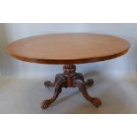 A 19th Century Mahogany Oval Centre Table, the moulded top above a plain frieze raised upon a reeded