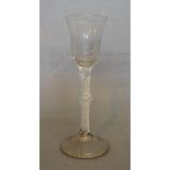 An 18th Century Drinking Glass with Bell Shaped Bowl above a Twisted Stem with Flattened Knop and