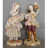 A Pair of German Porcelain Figures in the form of a Lady and Gentleman, the lady with bird cage,