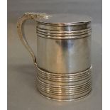 A George III Silver Plated Tankard, the hinged cover above a tapering ribbed body, 12cms tall