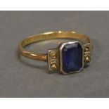 A 9ct. Yellow Gold Dress Ring set with rectangular blue stone