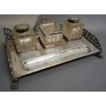 An Edwardian Silver Ink Stand of Pierced Form with two cut glass and silver mounted bottles, the