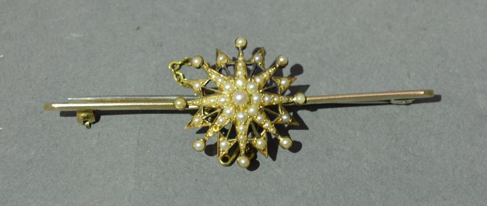 A Yellow Metal Large Bar Brooch mounted with a Pearl Set Star