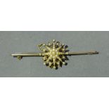 A Yellow Metal Large Bar Brooch mounted with a Pearl Set Star