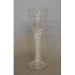 An 18th Century Drinking Glass, the funnel bowl above an opaque twist stem and conical foot, 14cms