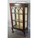 A 20th Century Mahogany Bow Fronted Display Cabinet with single glazed door enclosing shelves,