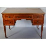 An Edwardian Mahogany Satinwood Crossbanded Writing Desk with five drawers and brass knob handles,