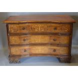 An Italian Walnut Marquetry Inlaid Inverted Commode with three drawers with circular brass handles