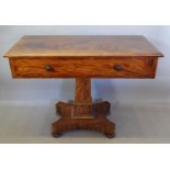 A 19th Century Mahogany Work Table with a frieze drawer with knob handles raised upon a