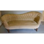 A 19th Century Spoon Back Sofa with a shaped button upholstered back and stuff over seat, raised