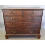 A George III Oak Chest, the crossbanded moulded top above two short and three long drawers with