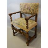 An 18th Century Walnut Armchair with Barley Twist Arms and similar legs with double barley twist