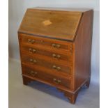 An Edwardian Mahogany Shell Inlaid Bureau, the fall front enclosing a fitted interior above four