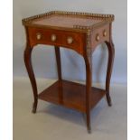 A French Kingwood Side Table, the brass galleried top inlaid with musical instruments above a frieze