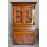 A 19th Century Mahogany Secretaire Bookcase, the moulded cornice above two arched doors enclosing