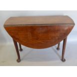 A George III Mahogany Oval Drop Flap Dining Table the turned legs with pad feet, 99 x 92 cms