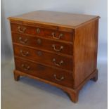 A George III Mahogany Bachelors Chest, the moulded top above a brushing slide and four long