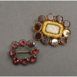 A Yellow Metal Mourning Brooch set with Garnets (AF) together with another similar garnet set brooch