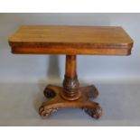 A William IV Rosewood Card Table, the hinged top enclosing a baise lined interior above a tulip