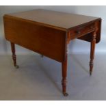 A William IV Mahogany Large Pembroke Table, the reeded top above a frieze drawer with knob handles