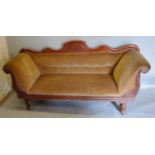 A Victorian Mahogany Scroll End Sofa with a shaped and button upholstered back raised upon turned