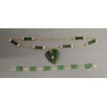 A 9ct. White Gold Jade Set Panel Bracelet together with a similar necklace with heart shaped pendant