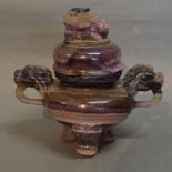 A 19th Century Chinese Amethyst and Stone Koro with Lion Ring Handles and three shaped supports,