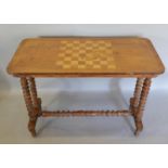A Victorian Walnut Games/Centre Table, the chess board inlaid top above turned legs with stretcher