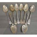 A Set of Four George III Silver Fiddle Pattern Table Spoons together with four other similar