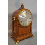 A Regency Mahogany Bracket Clock of Dome Form with brass pineapple finial and side carrying handles,