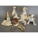 A USSR Porcelain Model in the form of a Tiger together with eight other similar USSR porcelain