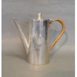 A Birmingham Silver Small Coffee Pot, with shaped handle, 13 cms tall, 9 ozs.