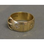 A 9ct. Yellow Gold Ring in the form of a buckle set with two diamonds, 7.5 gms.