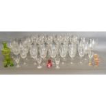 A Glass Drinking Set together with a set of twelve cut glass Hock glasses with grapevine etching