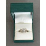 A 9ct. White Gold Diamond Ring of Modern Form set with many diamonds