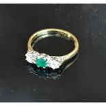 An 18ct. Gold Emerald and Diamond Ring, the central emerald flanked by diamonds, claw set