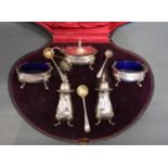 A Birmingham Silver Five Piece Cruet Set within fitted lined case