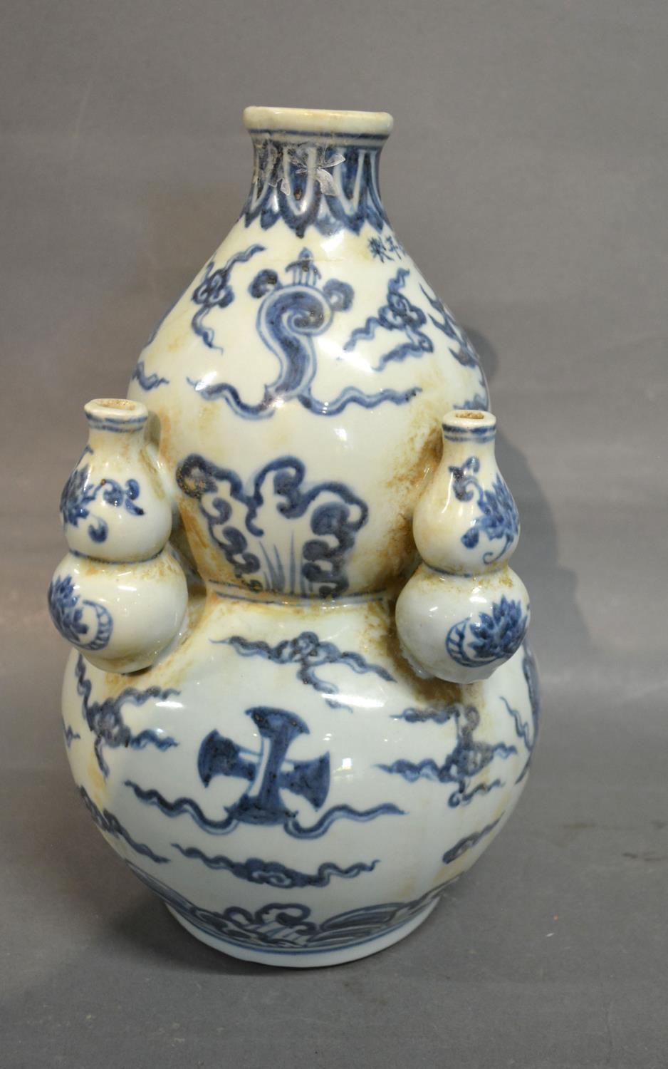 A Chinese Underglazed Blue Decorated Gourd Vase, 28 cms tall